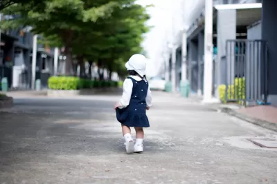 Toddler walking on street