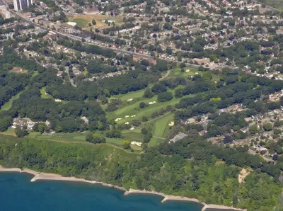 An aerial view of the Toronto Hunt Club and golf course, located along Lake Ontario amid residential homes in Toronto.