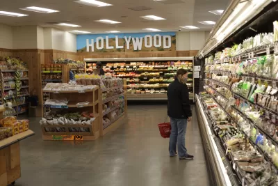 A woman in a mask shops at Trader Joe's.