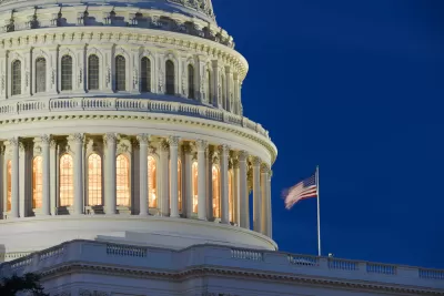 A close up image of the exterior of the U.S. Capitol Rotunda illuminated at dusk.