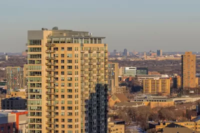 View of St. Paul skyline from Minneapolis with apartment building in foreground