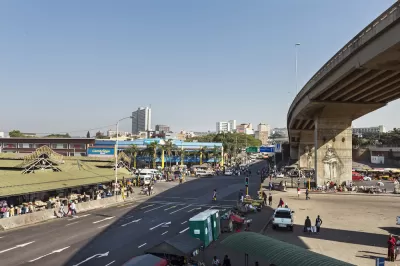 The public market at Warwick JUnction in Durban, South Africa is visible with the city ‘s high-rise buildings in the background.