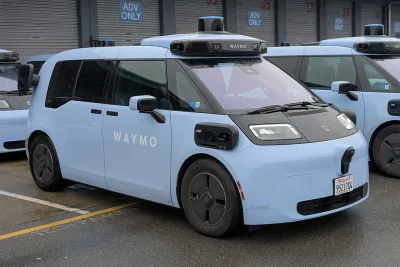 A light-blue Ojai vehicle. The car's design resembles a mini van.