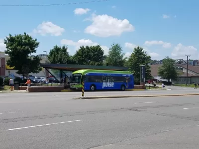 Pulse bus rapid transit station with blue bus pulled in in Richmond, Virginia