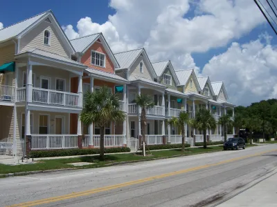 Row of colorful two-story houses close to each other in Ybor City, Florida.