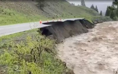 Floodwaters and damaged road in Yellowstone National Park