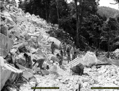 Incarcerated people work in a rock quarry, possibly Keith Quarry near Palmetto, Georgia, around 1948.
