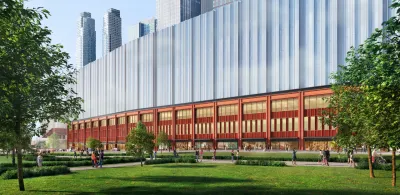 A large green space outside a tall, silver terminal.