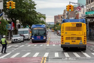 The new busway. The pavement is painted red, indicating it as a bus-only lane.