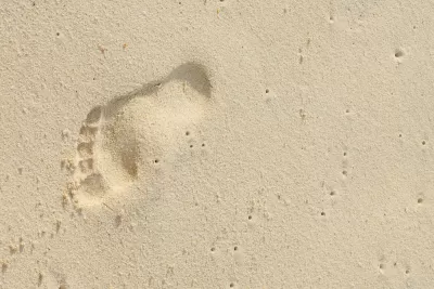 Footprint on sand at beach