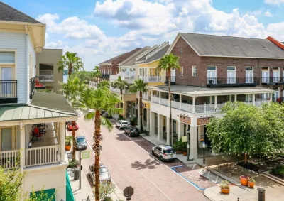 Two-story buildings with porches in walkable Florida neighborhood.