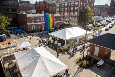 A large pride flag hangs over the Equality Community Center.