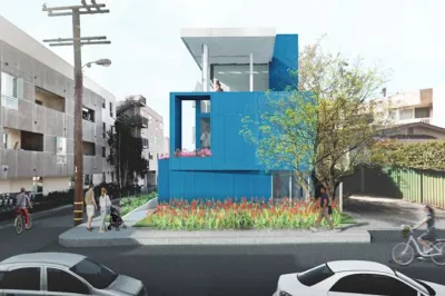 Rendering of blue boxy modular apartment building in Santa Monica, California.