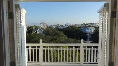 view out a window of rooftops of Seaside, Florida 