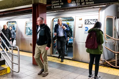 Passengers entering and exiting a New York City subway train at an underground station.