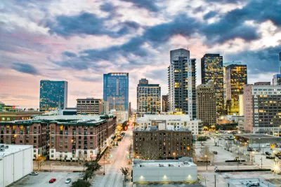 Colorful high-saturation view of downtown Houston, Texas with pink and blue dusk sky