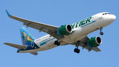 Frontier Airlines jet in the air.