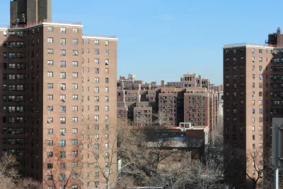 High-rise red brick public housing buildings in New York City.