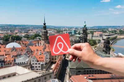 Airbnb logo over Dresden