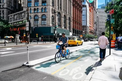 A rider on a Citibike on a bike lane in New York City