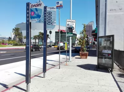Bus stop in downtown Los Angeles with billboard and no bench or shelter