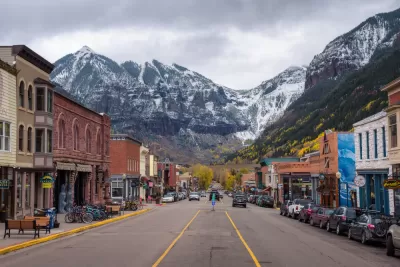 View from middle of street in downtown Telluride, Colorado with mountains in background