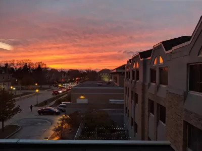 Suburban houses against colorful sunset sky in Waukesha, Wisconsin