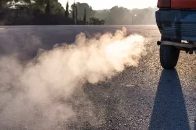 Close-up of car tailpipe emitting smoke