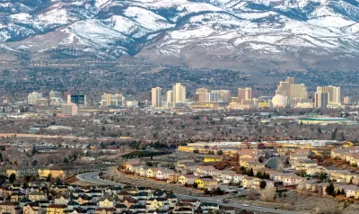 Aerial view of Reno, Nevada against snow-capped mountains in winter