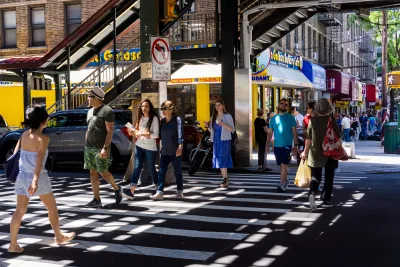 Crowd crossing the street in Astoria, Queens.