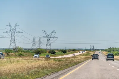 Highway road 84 near Snyder, Texas countryside with cars in traffic and power lines cables.