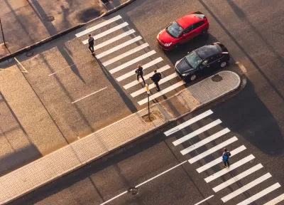Overhead view of crosswalk with pedestrian median
