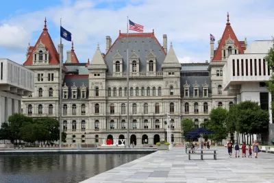 State capitol building in Albany, NY with two matching red pointed towers.
