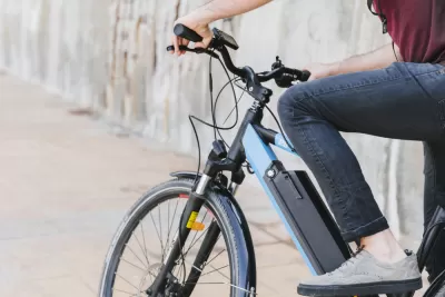 Close-up of person sitting on electric bike