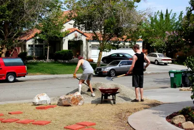 Two men working on a xeriscaped garden