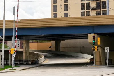 Elevated freeway segment with stoplight at underpass in Milwaukee, Wisconsin.
