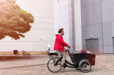 Man riding cargo bike with large front carrier