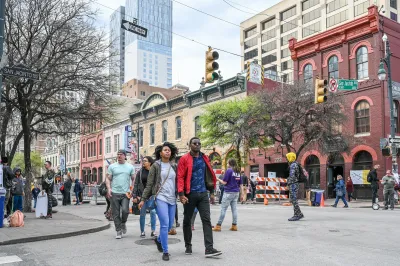 People walking on Sixth Street in Austin, Texas.