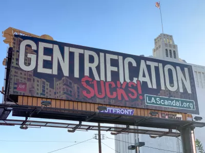 Billboard that says "Gentrification Sucks!" in Los Angeles, California