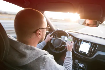 Man driving while texting