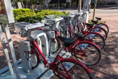 Docked BCycle bike share station in Houston with red bikes