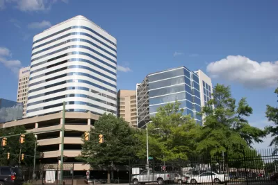 Richmond skyline with multistory parking garage and office buildings.