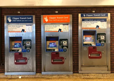 Three transit ticketing machines in a Bay Area station.