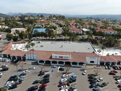 Aerial view of large store with parking and houses with beach in background in Rancho Penasquitos, California
