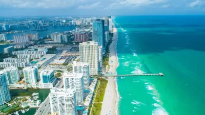 Aerial view of high-rise condominium buildings on beach in Miami, Florida