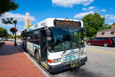 White Pawtucket RIPTA Bus on Roosevelt Avenue in downtown Pawtucket, Rhode Island