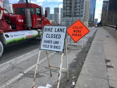 "Bike Lane Closed" and "Utility Work Ahead" signs on Chicago bike lane