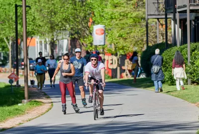 People biking and rollerblading on Atlanta BeltLine trail