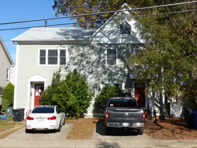 Wooden duplex home with two driveways in Arlington, Virginia