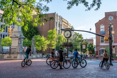 Group of teens with bikes stopped in public plaza in Lancaster, Pennsylvania.